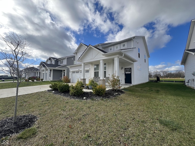 view of front of house with a front lawn and a garage