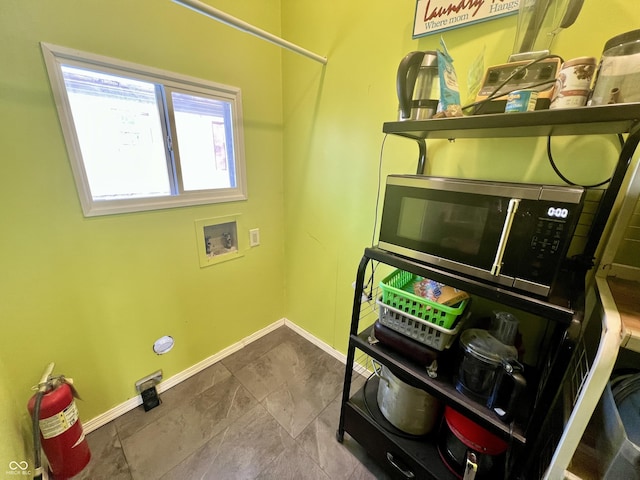 interior space with tile patterned flooring and washer hookup