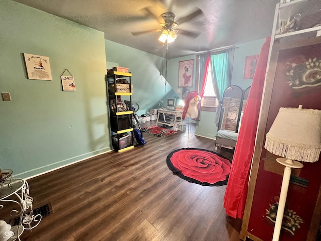 recreation room with ceiling fan and wood-type flooring