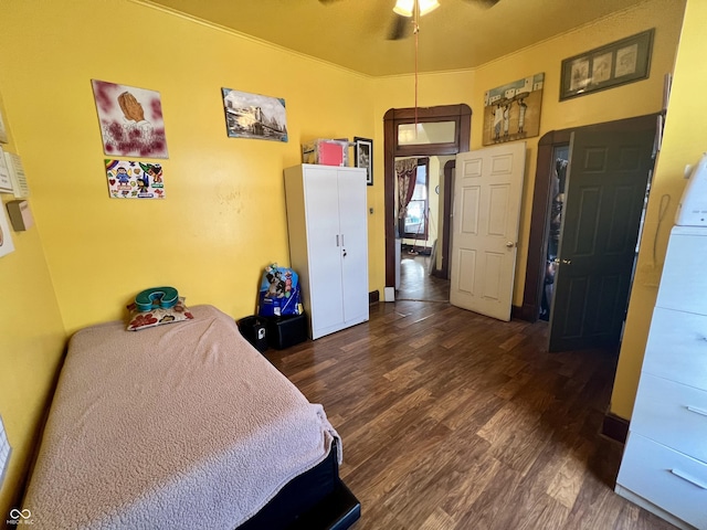 bedroom featuring dark hardwood / wood-style flooring and ceiling fan