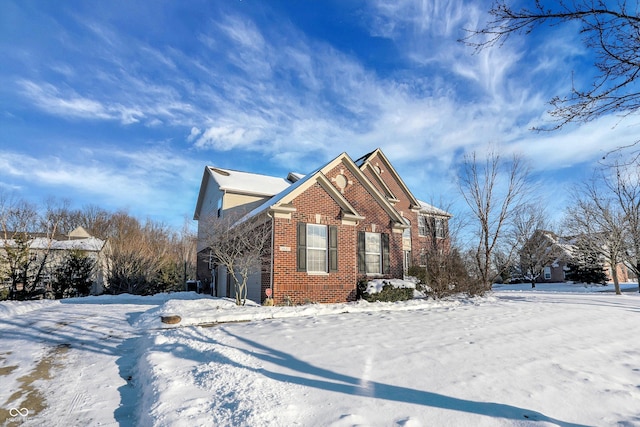 view of snow covered property