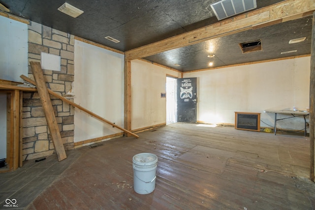 basement featuring wood-type flooring