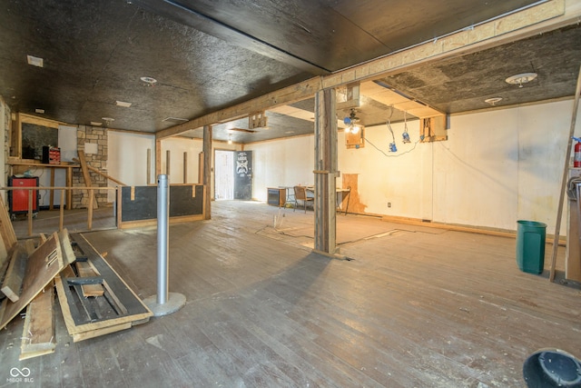 basement featuring wood-type flooring