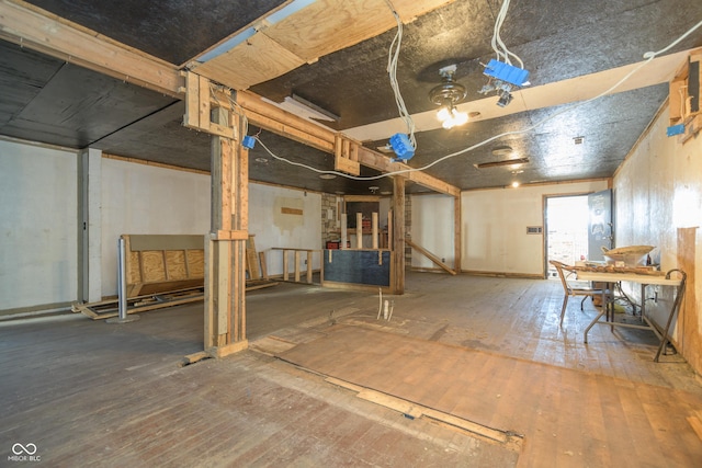 basement with hardwood / wood-style floors