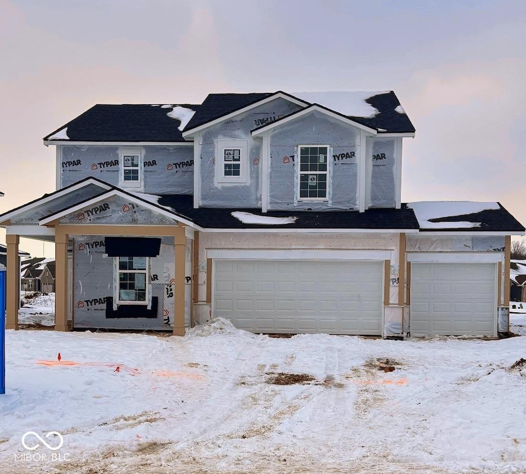 property in mid-construction with a garage