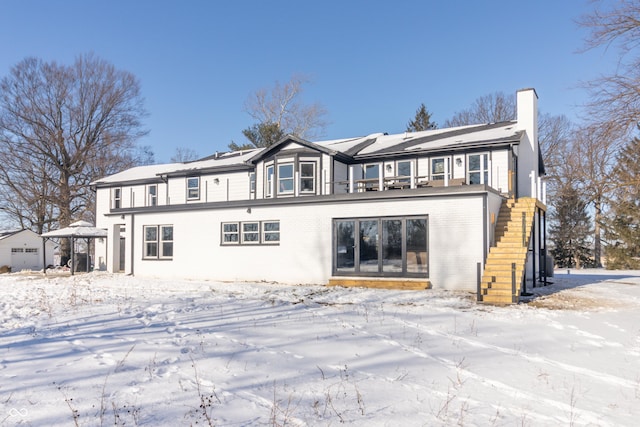 view of snow covered house