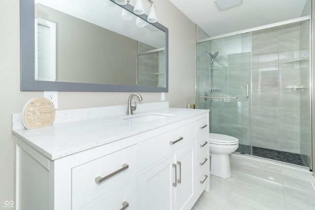 bathroom with vanity, toilet, walk in shower, and tile patterned floors