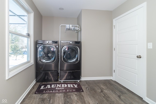 washroom with washer and clothes dryer and dark hardwood / wood-style flooring