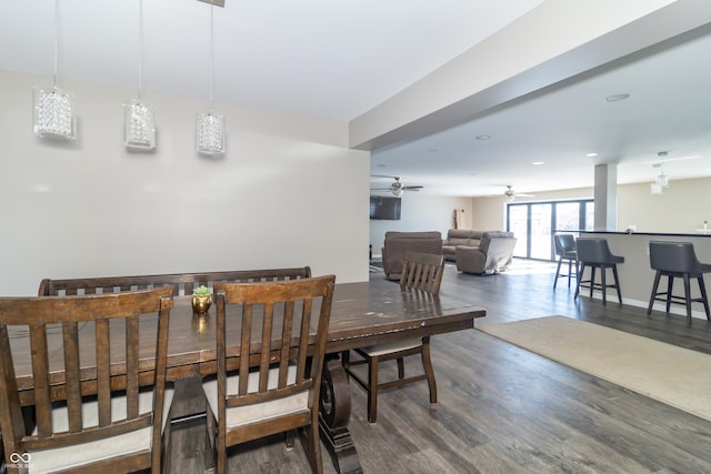 dining area featuring ceiling fan and dark hardwood / wood-style floors