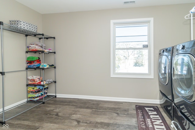 laundry area featuring washing machine and clothes dryer