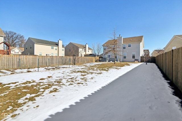 view of yard covered in snow