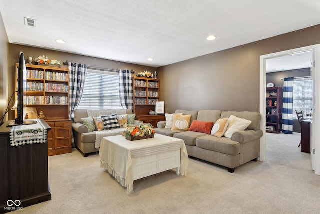 carpeted living room with plenty of natural light