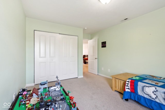 carpeted bedroom with a closet