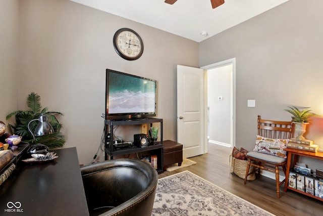 home office featuring hardwood / wood-style flooring and ceiling fan