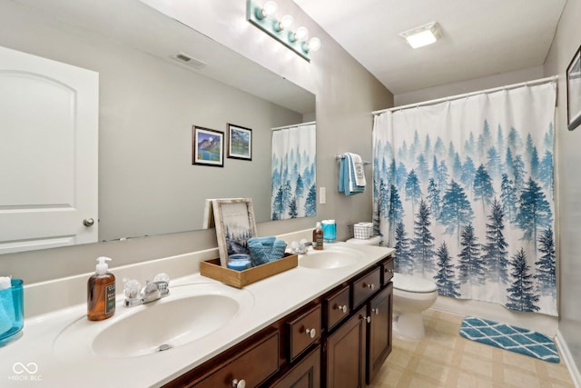 bathroom with vanity, toilet, and a shower with shower curtain