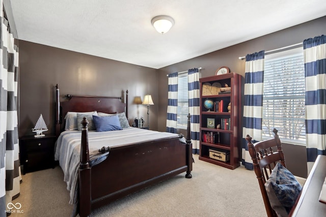 bedroom with light colored carpet