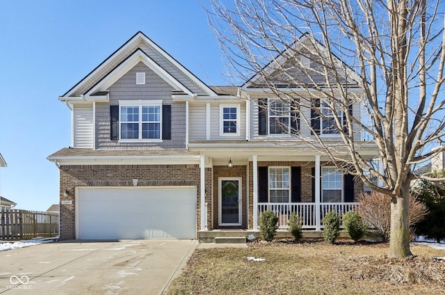 view of front of property with a garage and covered porch