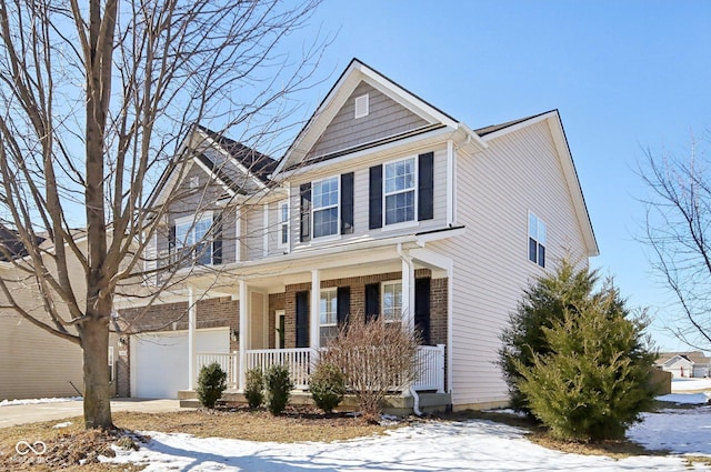 view of front of house with a garage and covered porch