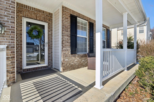 doorway to property featuring covered porch