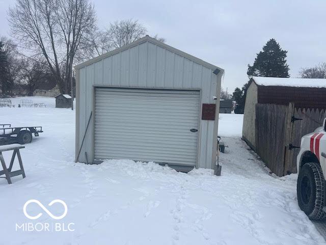 view of snow covered garage