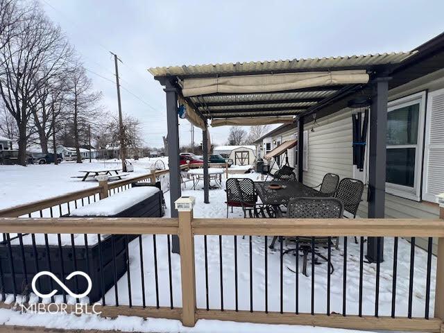 view of snow covered deck