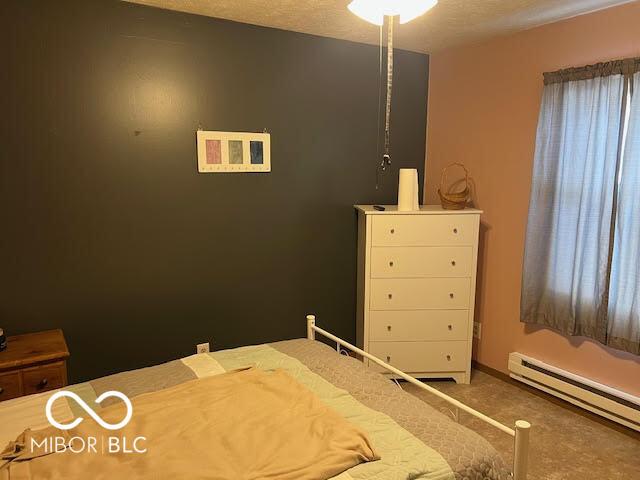 bedroom featuring baseboard heating