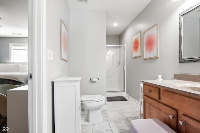 ensuite bathroom with toilet, vanity, a shower stall, ensuite bath, and tile patterned floors