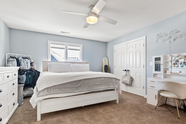 bedroom featuring ceiling fan, a closet, and carpet flooring