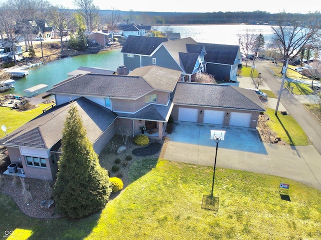 aerial view featuring a residential view and a water view