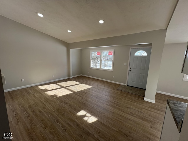 entrance foyer with dark hardwood / wood-style floors