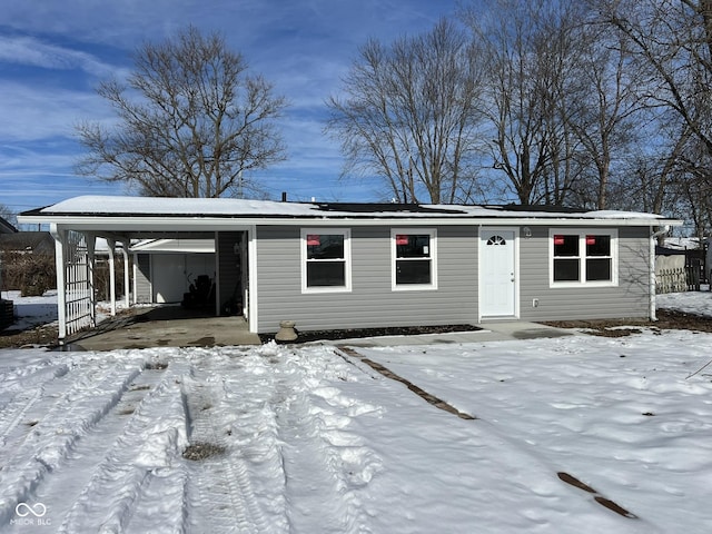 view of front of home featuring a carport