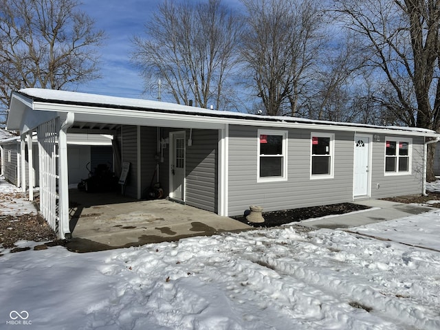 view of front of home featuring a carport