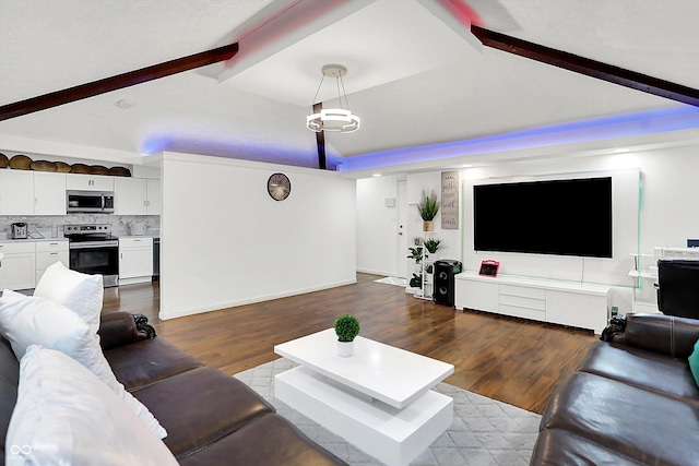 living room featuring hardwood / wood-style flooring and vaulted ceiling with beams