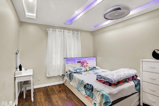 bedroom featuring dark hardwood / wood-style flooring