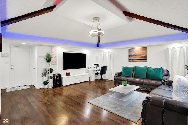 living room featuring dark hardwood / wood-style flooring and vaulted ceiling with beams