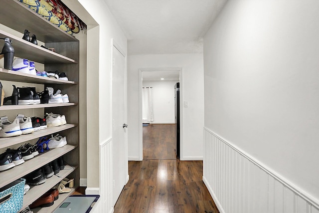 hall with dark wood-type flooring