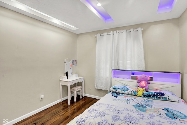 bedroom featuring dark hardwood / wood-style flooring