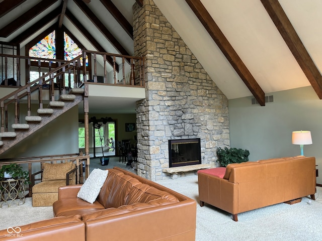 living room with beam ceiling, a stone fireplace, high vaulted ceiling, and light carpet