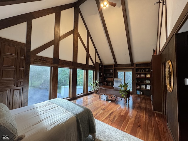 bedroom with high vaulted ceiling, wood-type flooring, and beamed ceiling