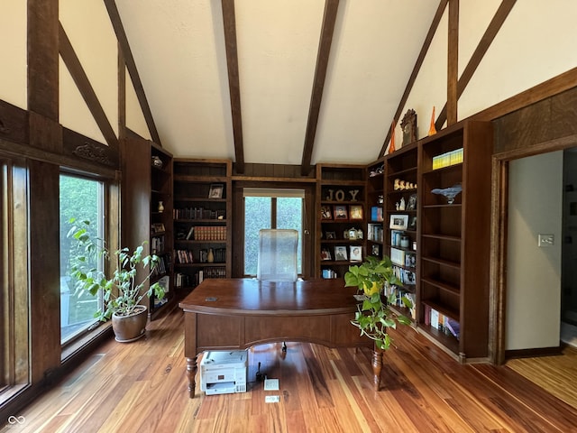 office area featuring wood-type flooring, high vaulted ceiling, and a healthy amount of sunlight