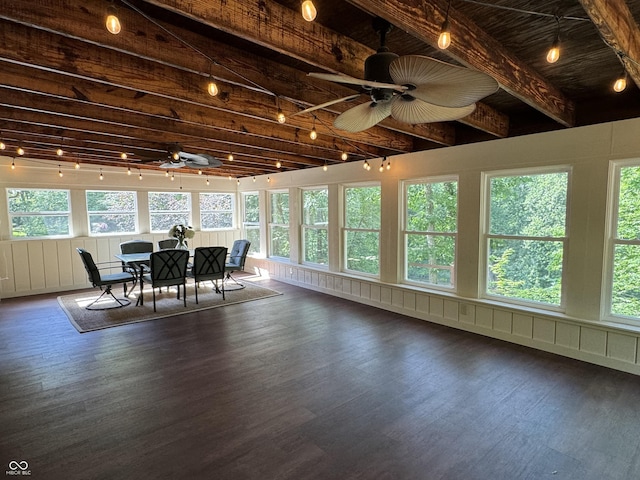 sunroom with beam ceiling and ceiling fan