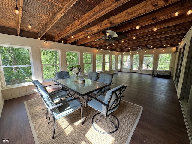 sunroom featuring beam ceiling and ceiling fan