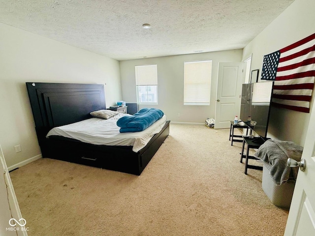 carpeted bedroom with a textured ceiling