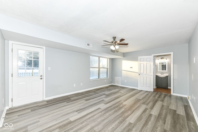 interior space with ceiling fan, light hardwood / wood-style floors, and a healthy amount of sunlight