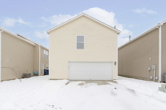 exterior space featuring a garage and central AC unit