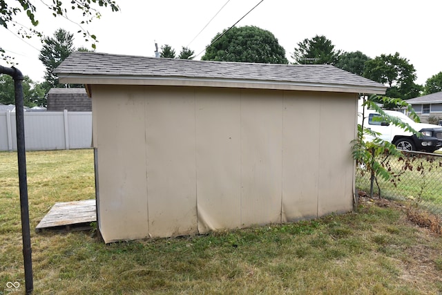 view of outdoor structure featuring a lawn