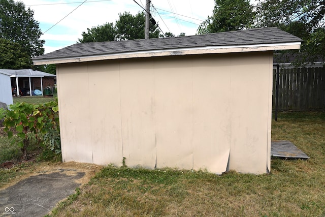 view of outdoor structure with a lawn