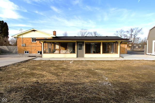 rear view of property featuring a patio