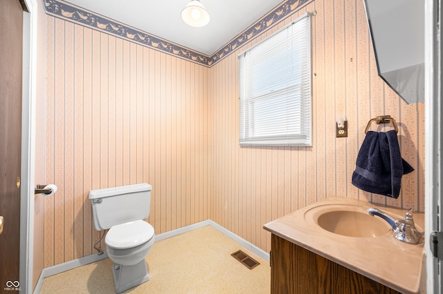 bathroom with toilet and vanity