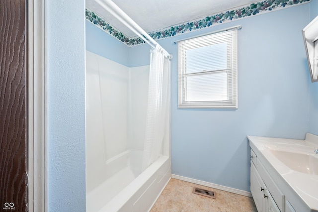 bathroom featuring tile patterned flooring, shower / bath combination with curtain, and vanity